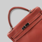 Kelly 32 Handbag Taurillion Clemence Orange Palladium Hardware