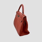 Kelly 32 Handbag Taurillion Clemence Orange Palladium Hardware